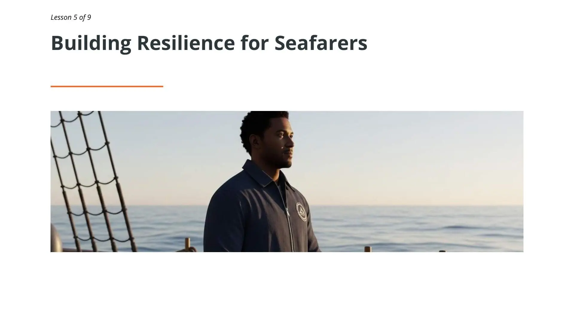 Male seafarer standing on deck with rigging visible, demonstrating resilience and mental health awareness training for maritime professionals