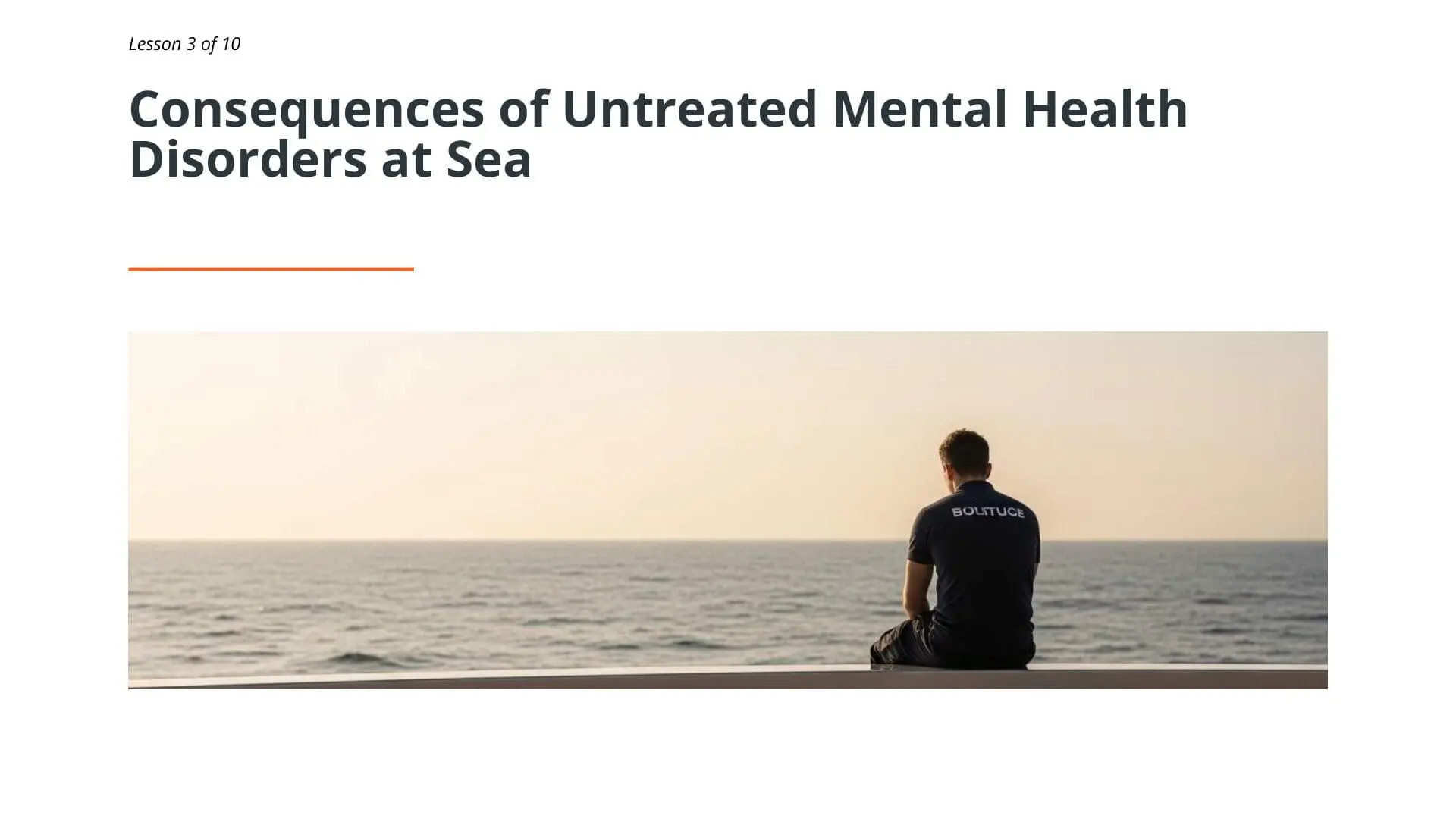 Superyacht crew member in uniform sitting alone facing the sea, representing mental health challenges and isolation in maritime work environments