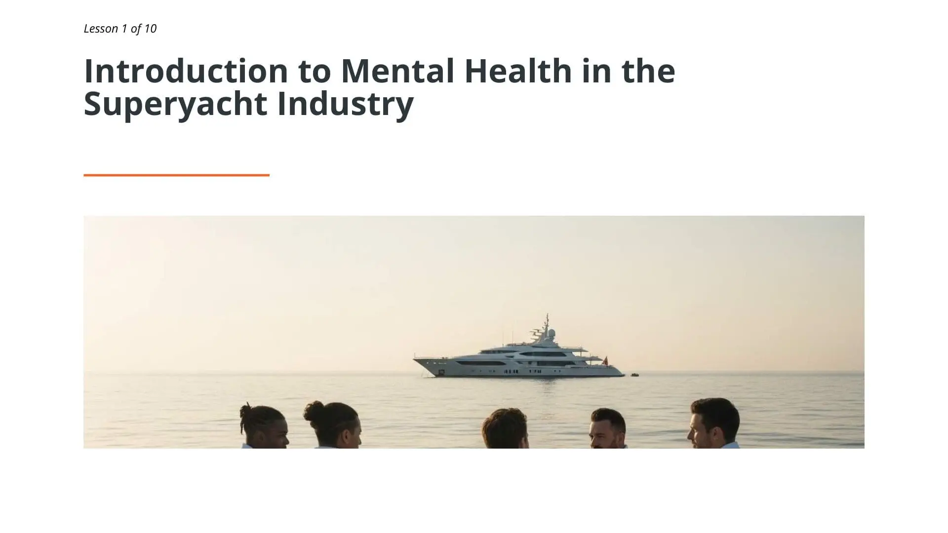 Superyacht crew members viewing luxury yacht at sea, representing mental health awareness training for maritime professionals