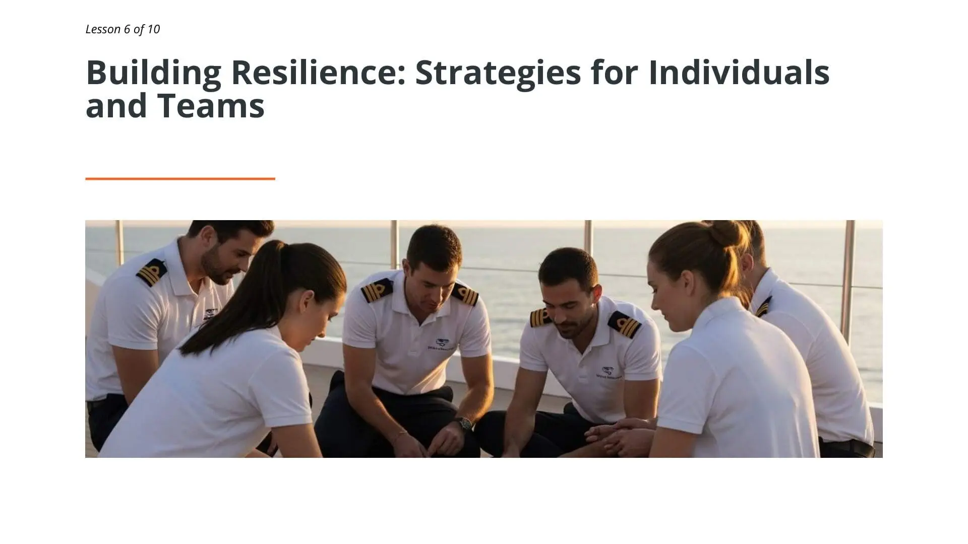 Superyacht crew members in white uniforms sitting together in circle for team resilience training and mental health awareness discussion