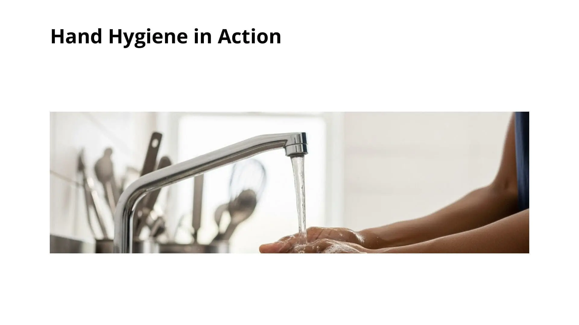 Person rinsing hands under running water from kitchen faucet, demonstrating proper hand hygiene technique for food safety training