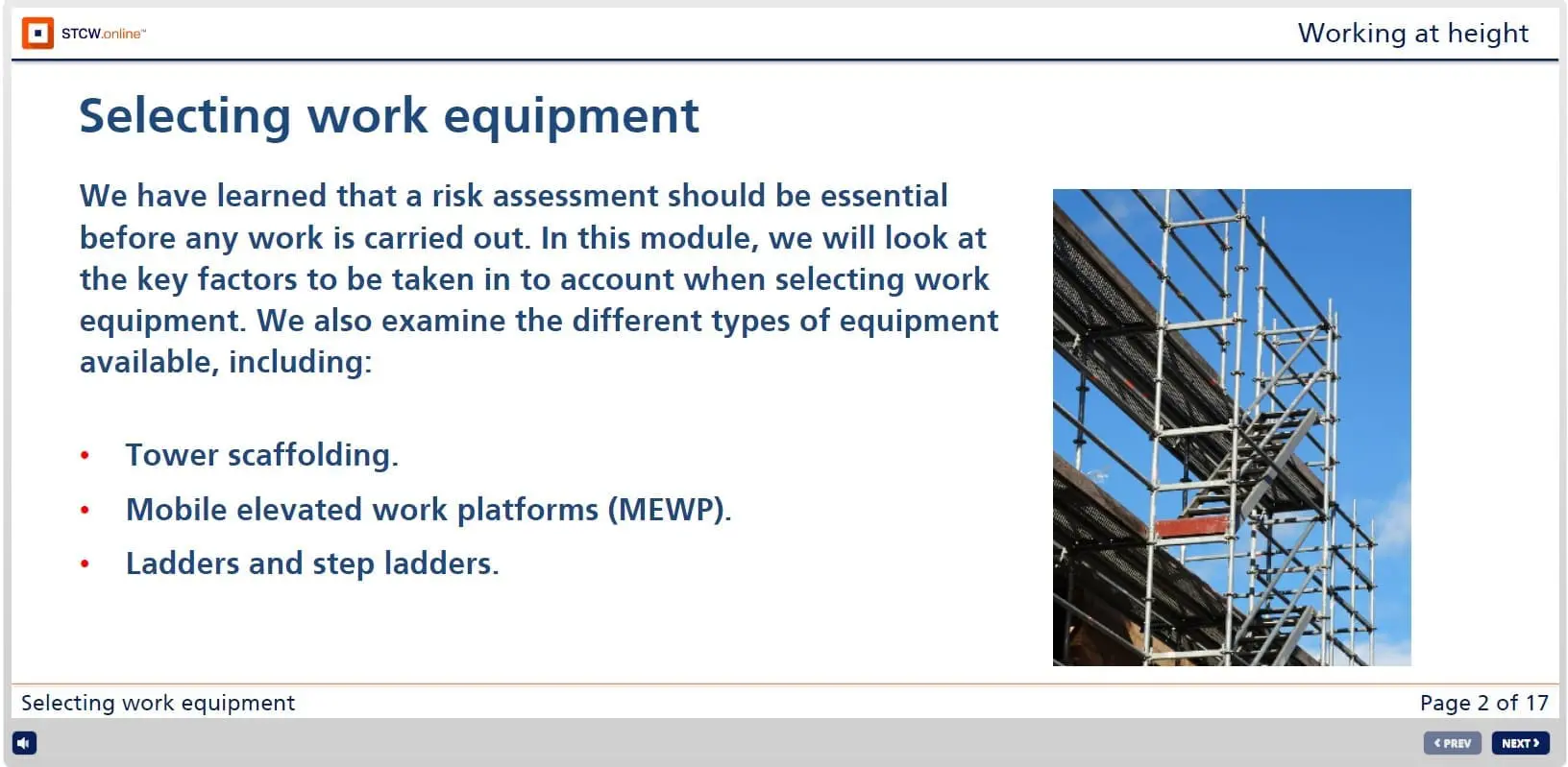 Tower scaffolding structure used for safe working at heights with metal framework and safety railings against blue sky