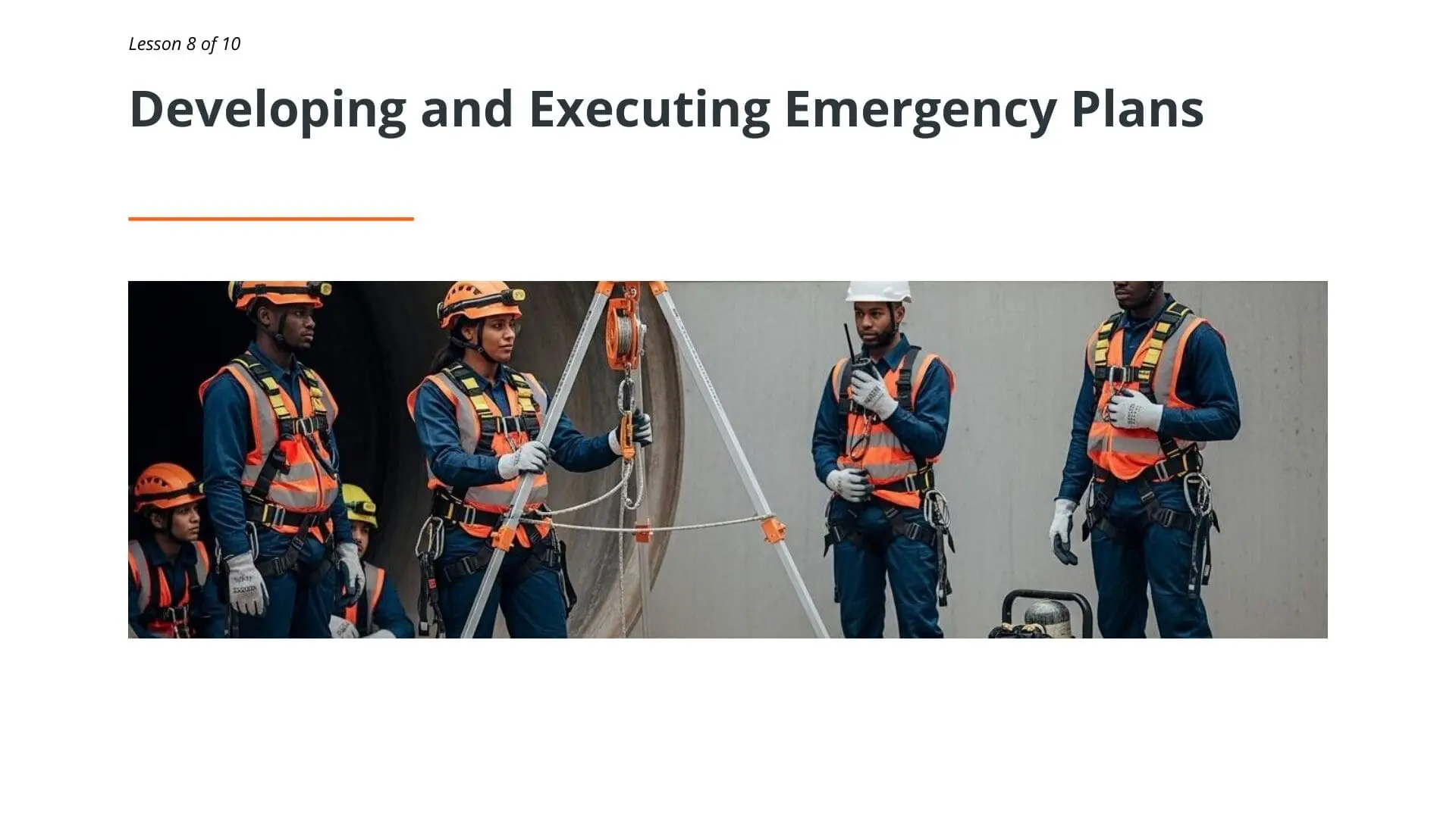 Safety professionals in hard hats and harnesses demonstrating confined space emergency rescue procedures and equipment during training