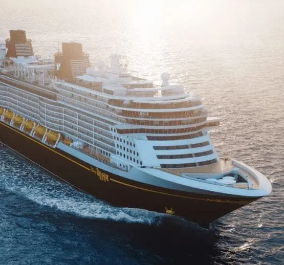 Modern cruise ship sailing on ocean waters during daytime, representing maritime training and professional seafaring education
