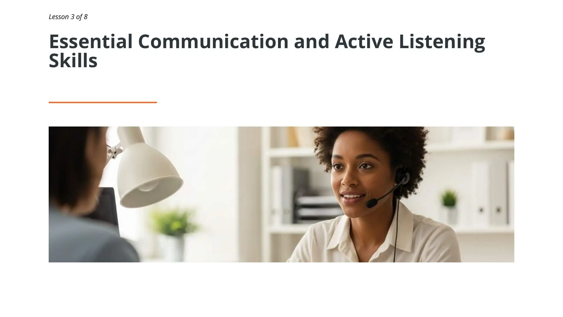 Customer service representative wearing headset smiling during professional communication training for complaint handling and active listening skills