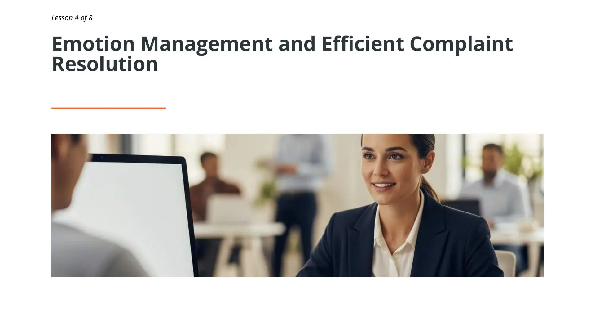 Professional woman in business attire smiling during complaint handling training session in modern office environment