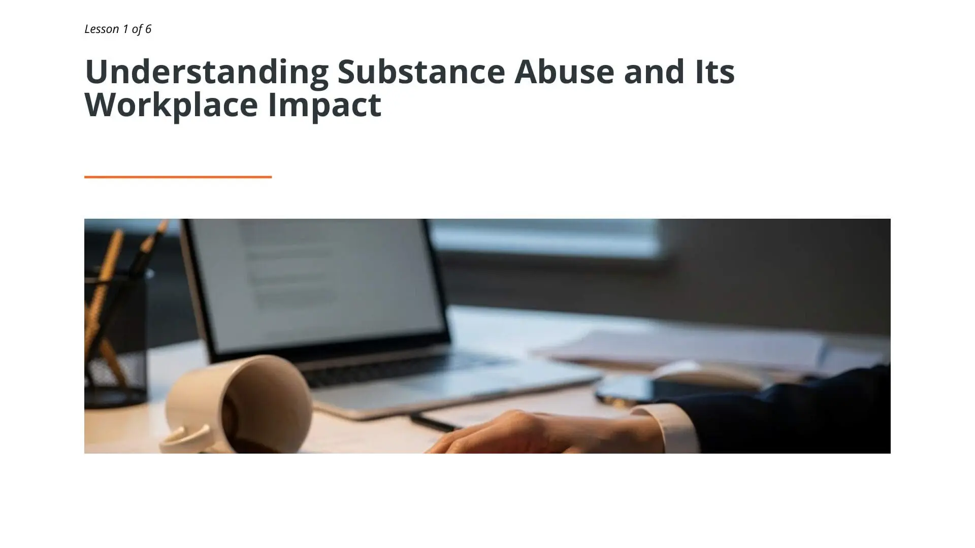 Professional workspace with laptop and documents illustrating substance abuse awareness training for maritime professionals
