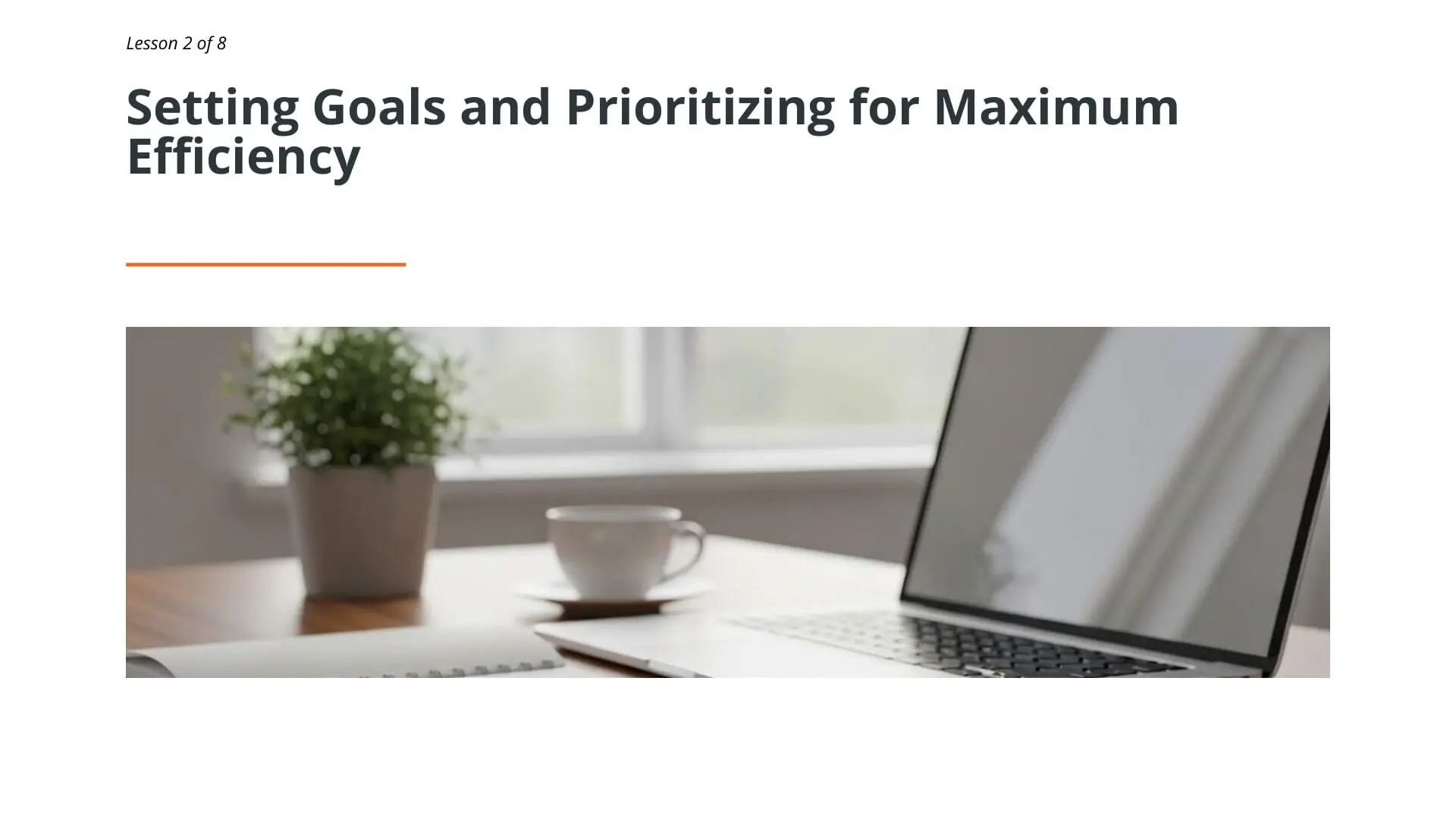 Professional workspace with laptop, notebook, coffee cup, and potted plant illustrating goal setting and prioritization strategies for maritime time management training
