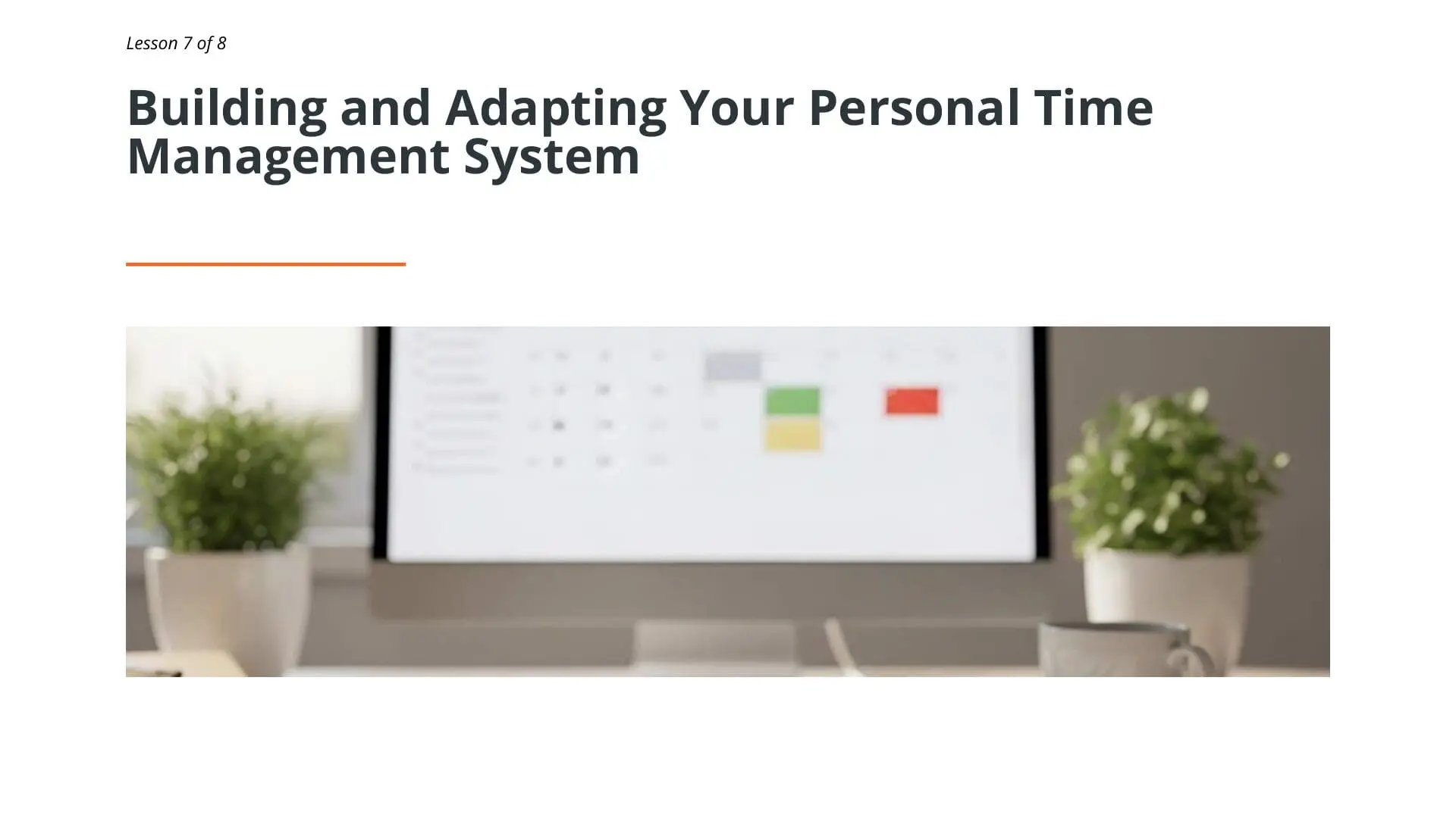 Desktop workspace displaying time management system with color-coded task planning calendar on computer monitor, flanked by potted plants