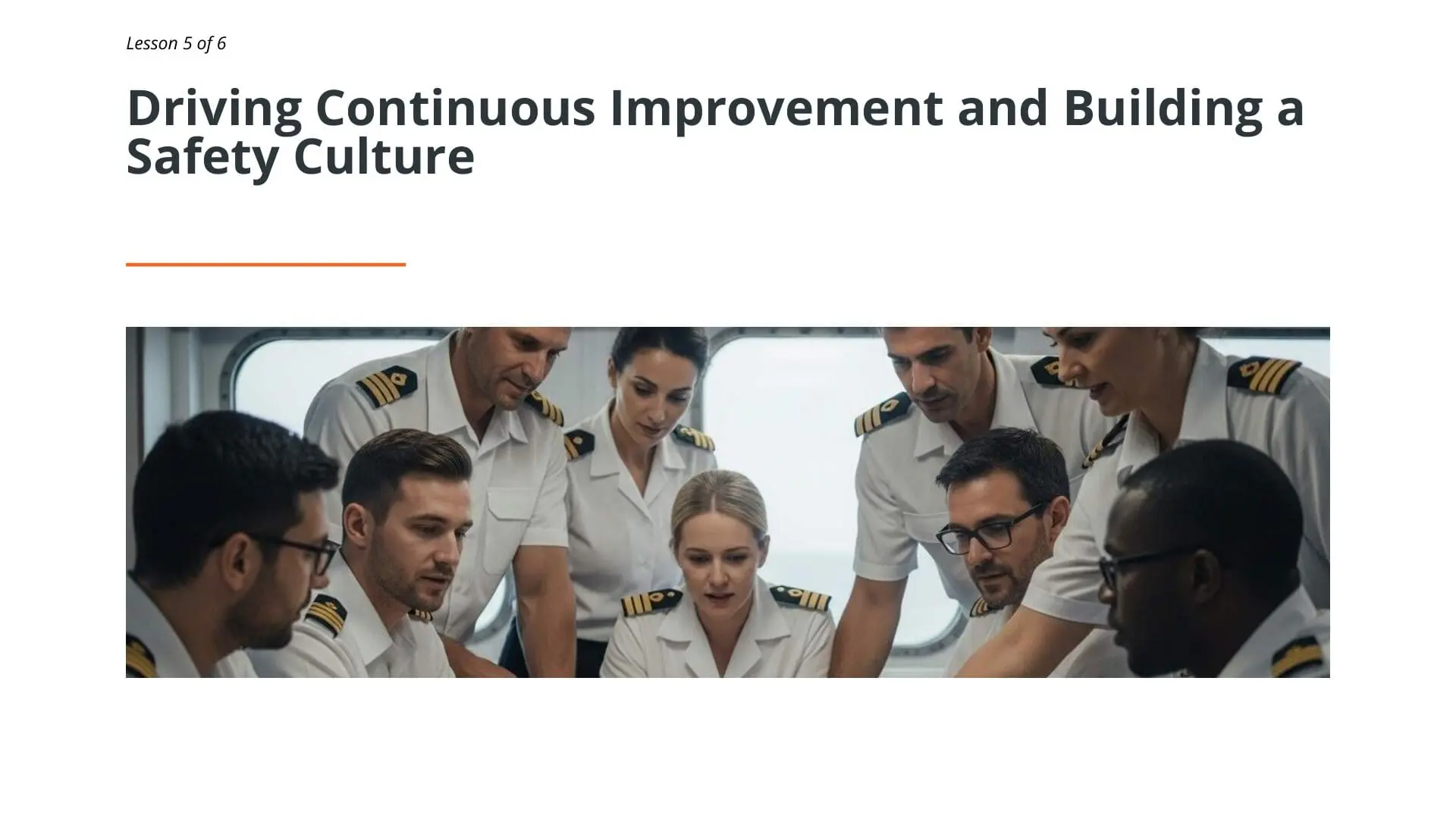 Ship officers and crew members gathered in discussion, demonstrating continuous improvement and safety culture training for maritime professionals