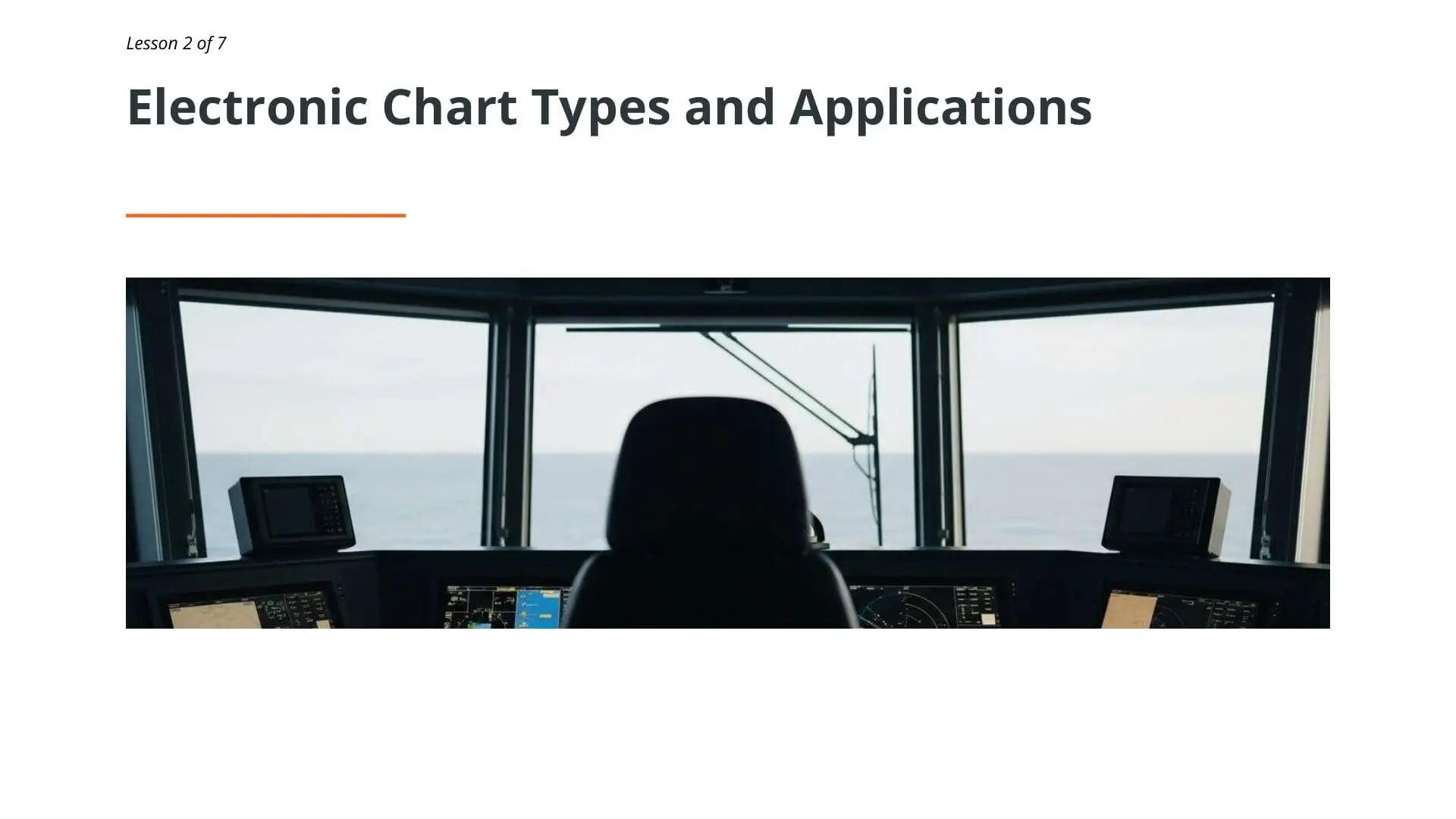 Ship bridge wheelhouse with ECDIS electronic chart display systems and navigation equipment overlooking open sea