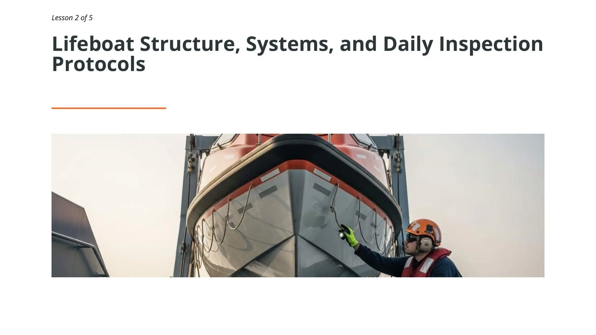 Maritime worker inspecting free-fall lifeboat hull structure during safety protocol training for emergency response operations