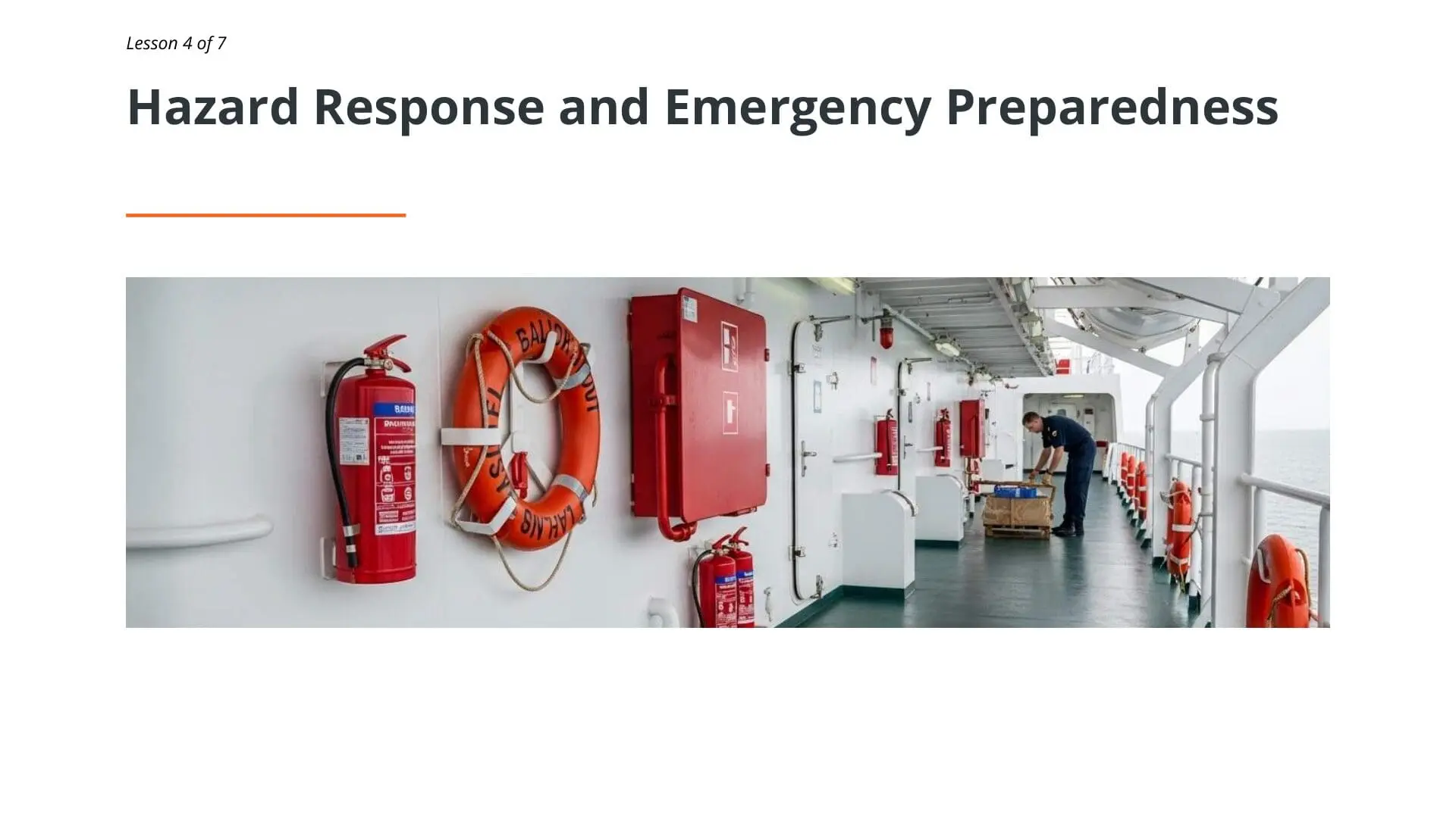 Ship corridor displaying fire extinguishers, life ring, first aid box, and emergency equipment for maritime safety preparedness and hazard response
