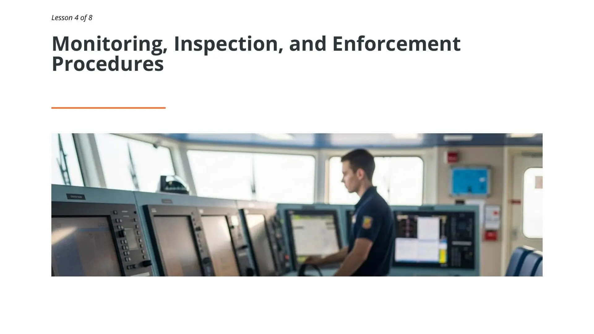 Officer monitoring multiple control displays on ship bridge for vessel operations and compliance monitoring