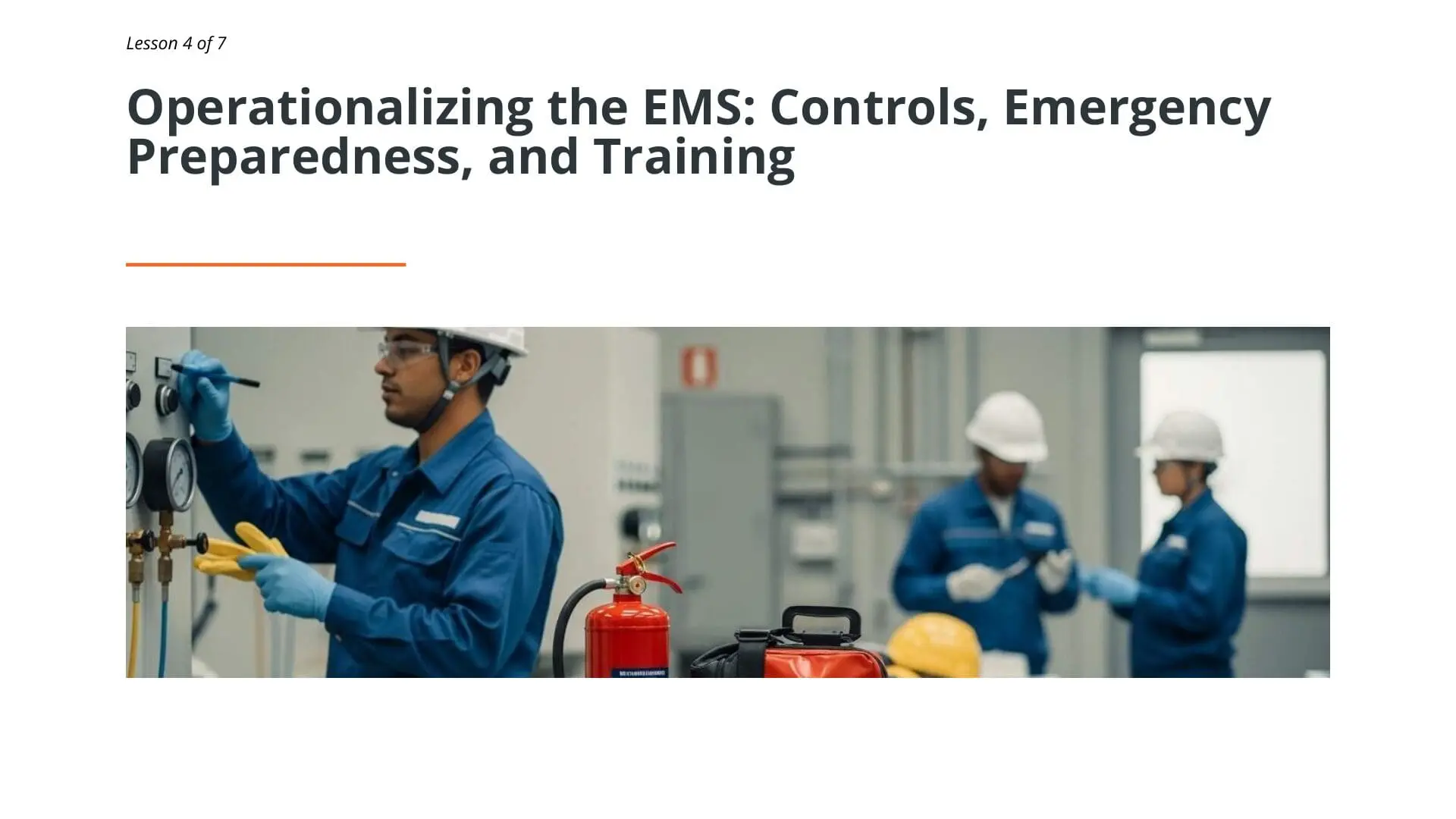 Workers in blue uniforms and hard hats performing EMS controls training with fire extinguisher and emergency equipment in industrial facility