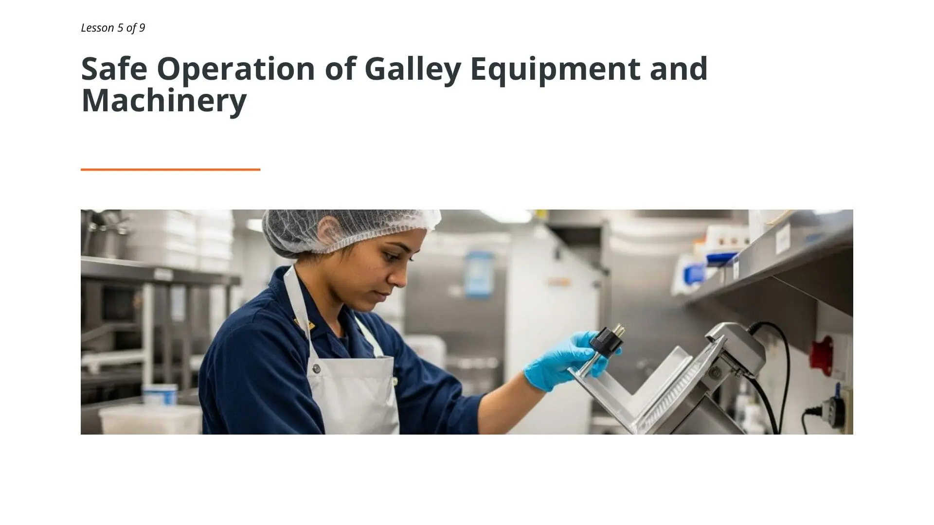 Female galley crew member in hairnet and blue gloves operating commercial kitchen equipment during maritime galley safety training