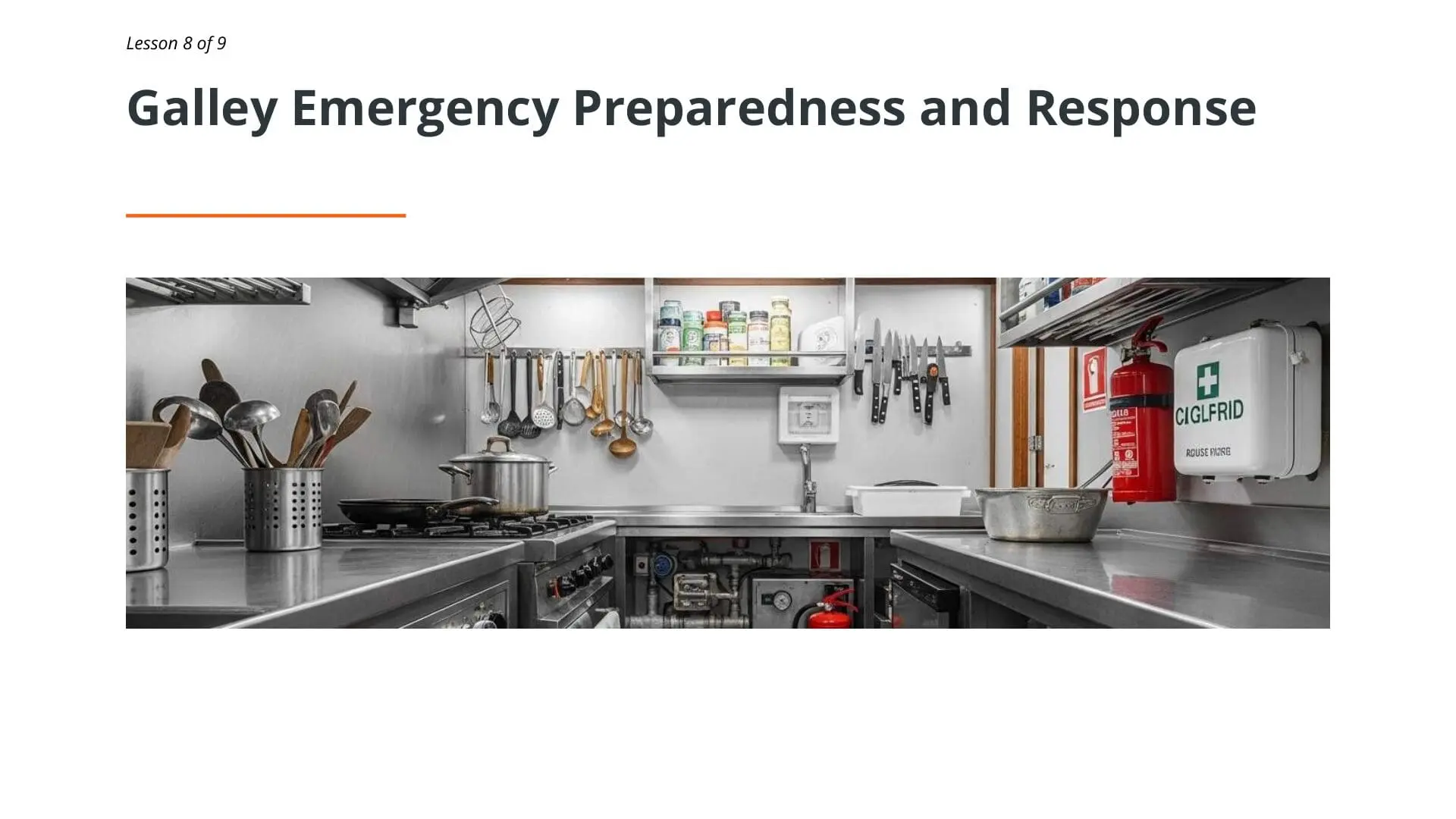 Professional maritime galley kitchen with safety equipment including fire extinguisher and first aid kit, demonstrating emergency preparedness for ocean-going vessels