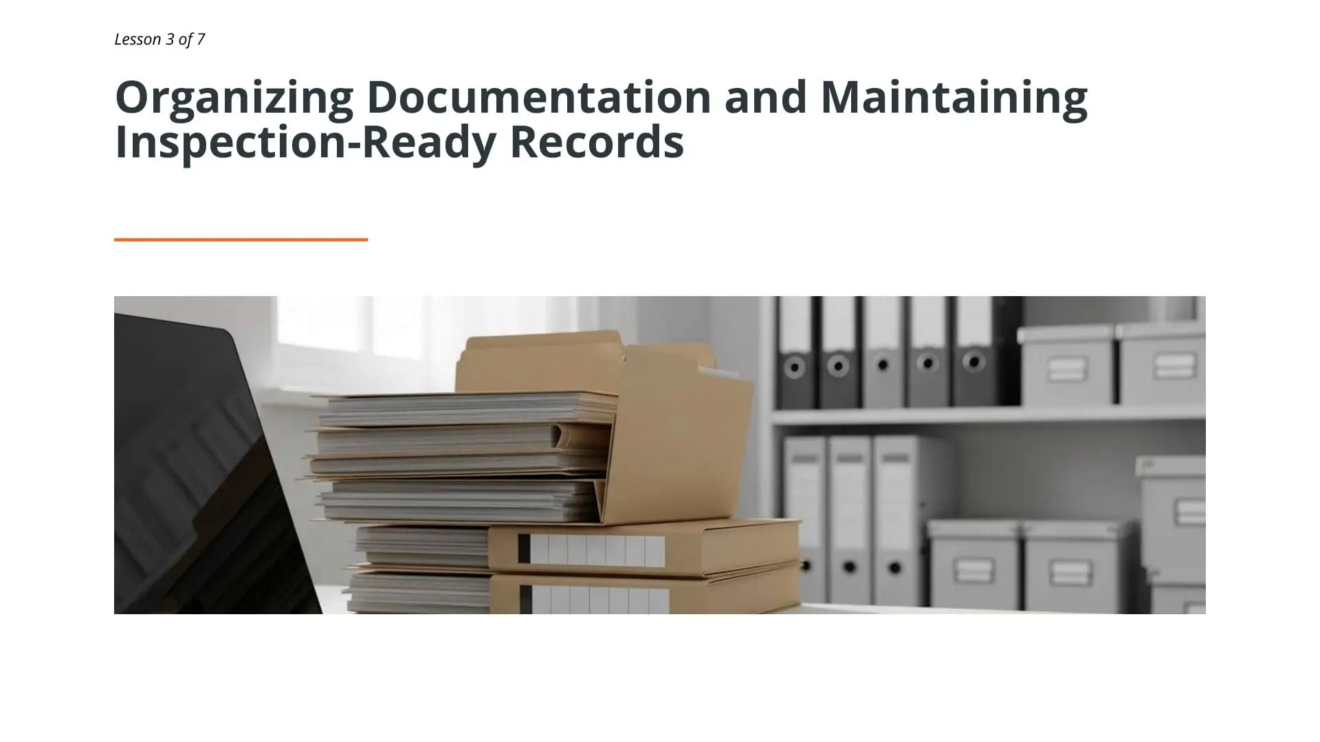 Stacked cardboard boxes and filing folders on desk with organized binders on shelves, representing documentation organization for SIRE 2.0 inspections