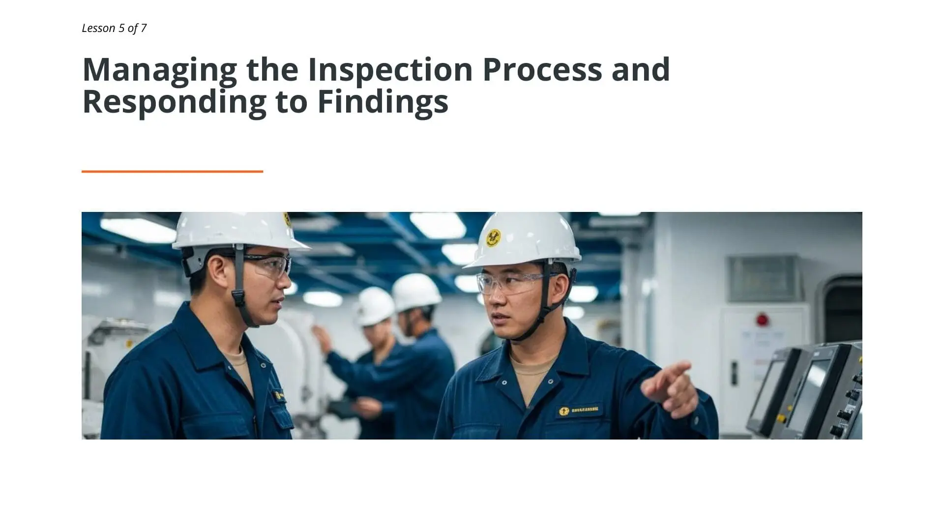 Two maritime workers in hard hats and blue uniforms discussing inspection findings during SIRE 2.0 inspection management process on vessel