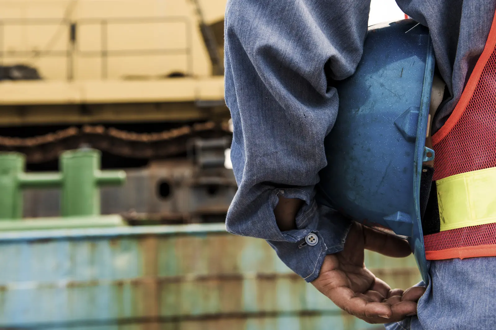 Safety officer inspecting hazardous materials inventory on cargo ship for IHM awareness training compliance