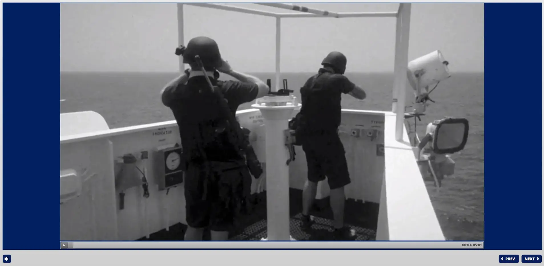 Two ship security officers monitoring vessel operations from bridge observation deck during Ship Security Officer STCW training