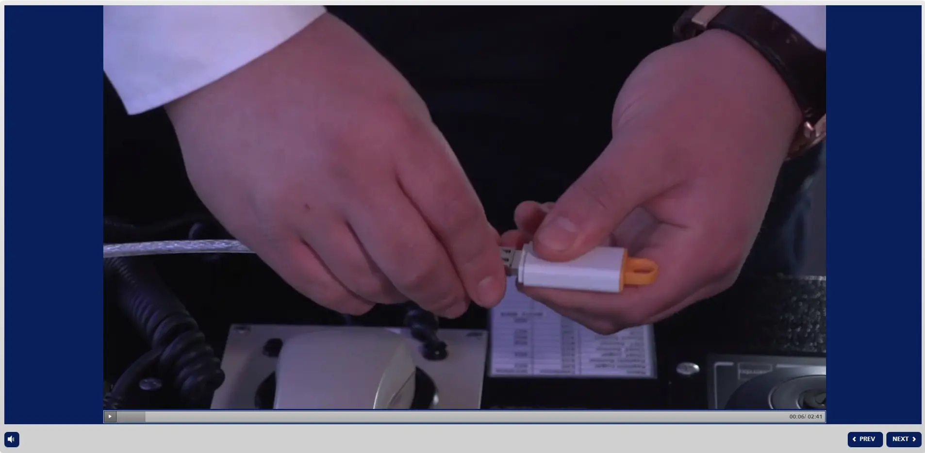 Hands demonstrating proper connection of a safety device during cyber security maritime training on STCW.online